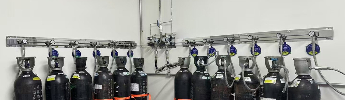 Laboratory gas cylinders connected to a high-purity gas supply manifold
