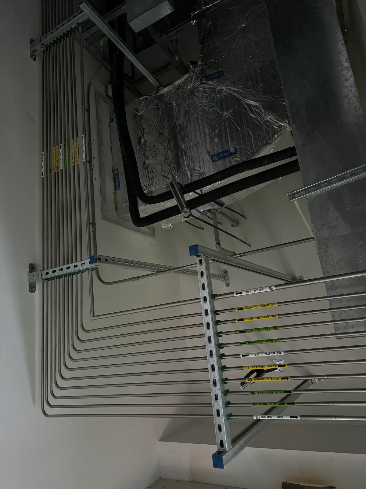 Stainless steel gas pipe run in a service area