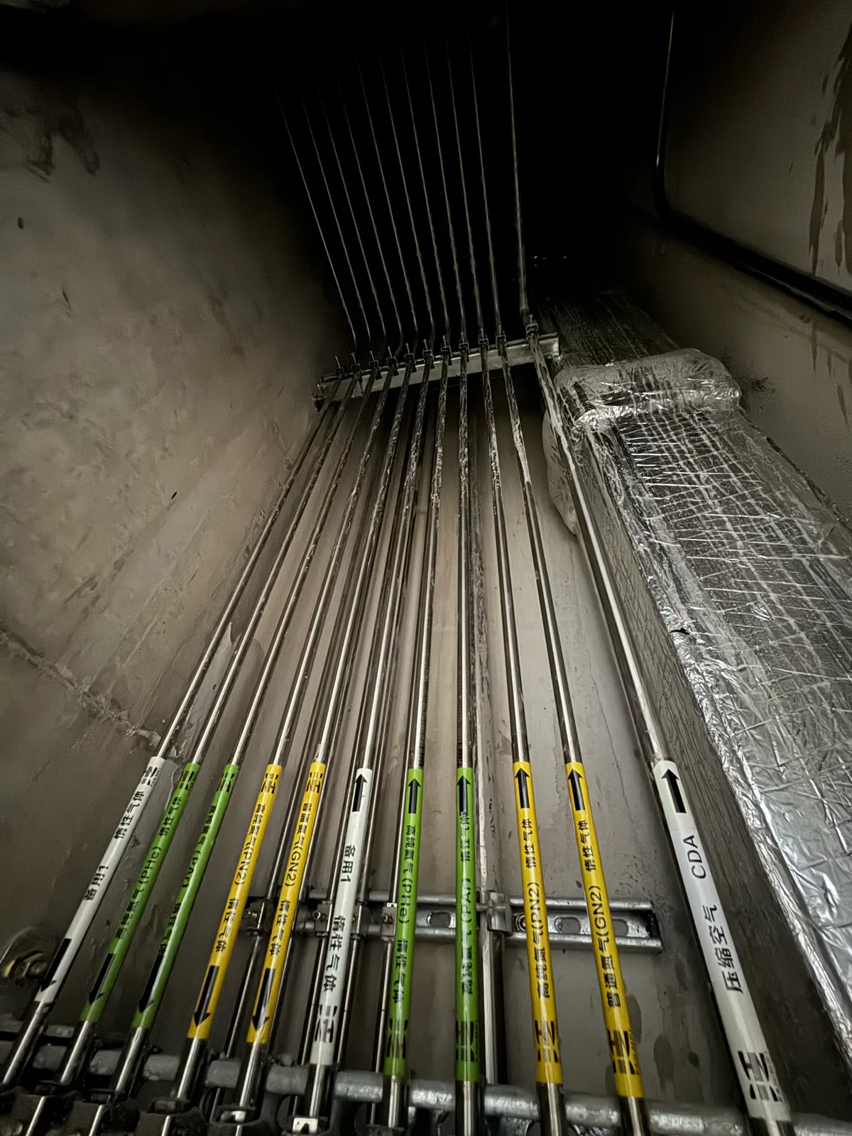 Parallel stainless-steel gas lines in a service route