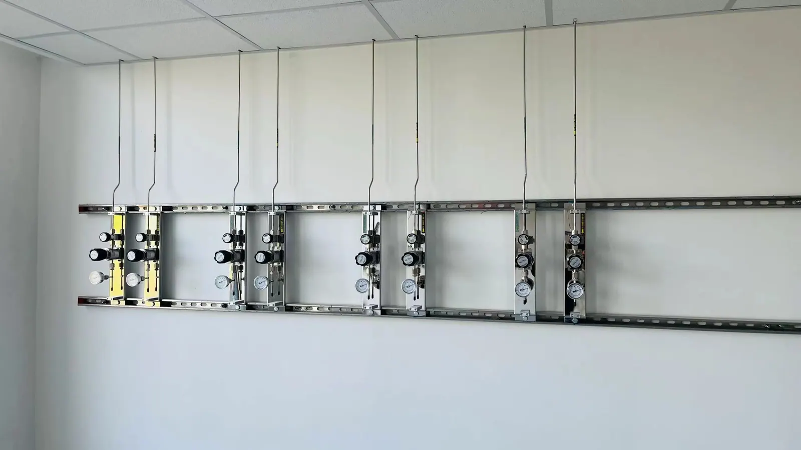 Multiple laboratory gas terminal stations on a wall