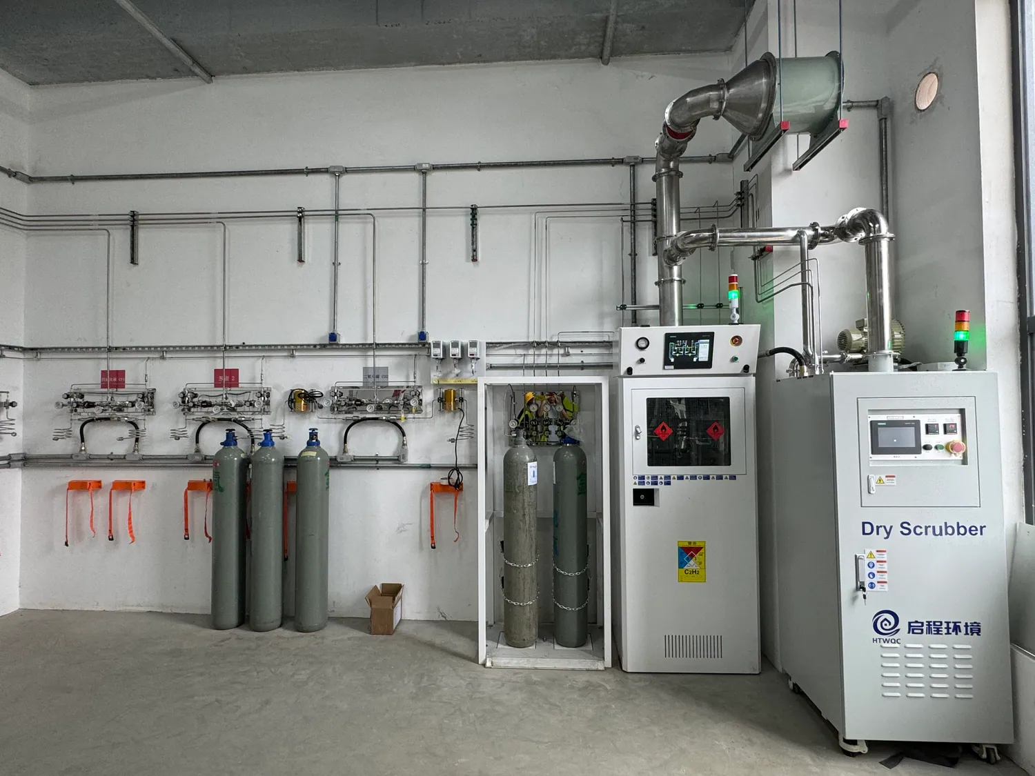 Specialty-gas source area with cabinets and adjacent service equipment